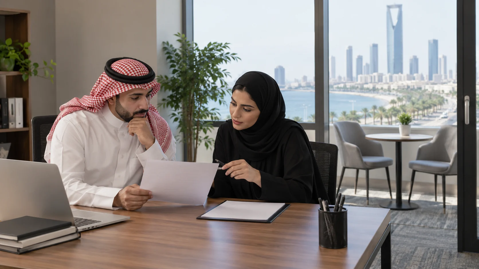 recruitment coordinators discussing role profiles at an interview table